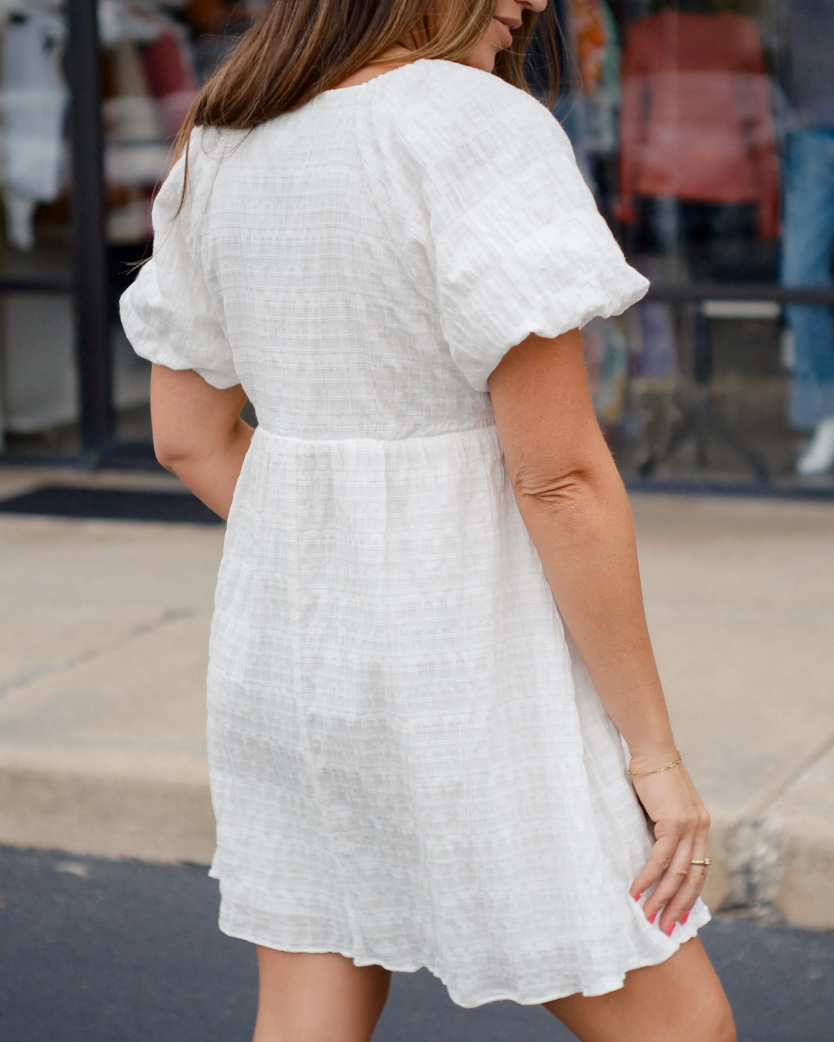 PURE SWEETNESS TEXTURED PUFF SLEEVE TIE  MINI DRESS - WHITE