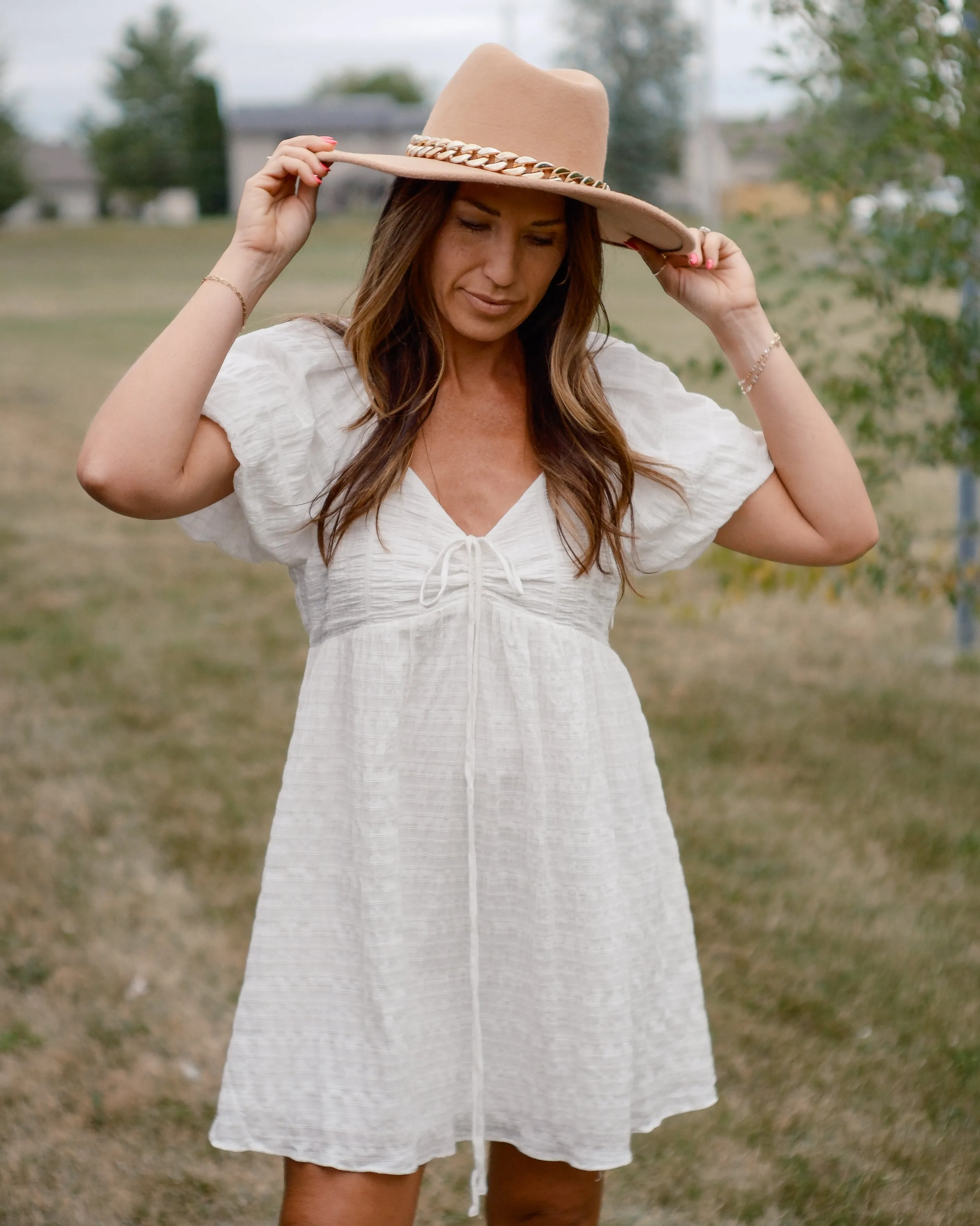 PURE SWEETNESS TEXTURED PUFF SLEEVE TIE  MINI DRESS - WHITE